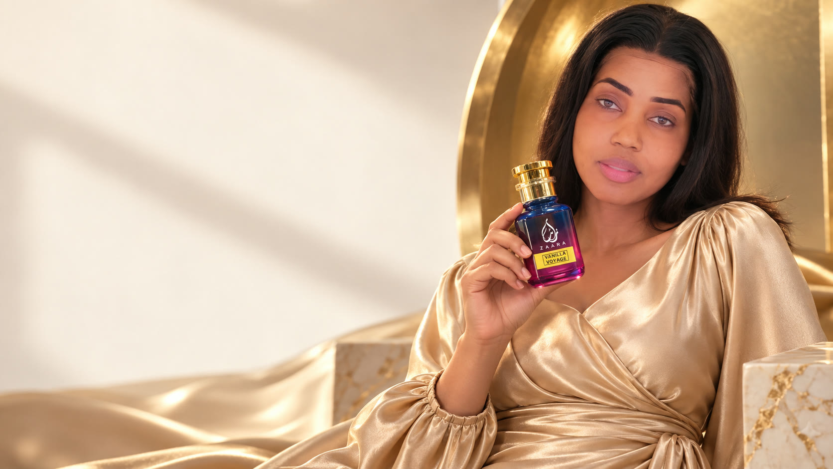 Debo in champagne satin holding Zaara Vanilla Voyage